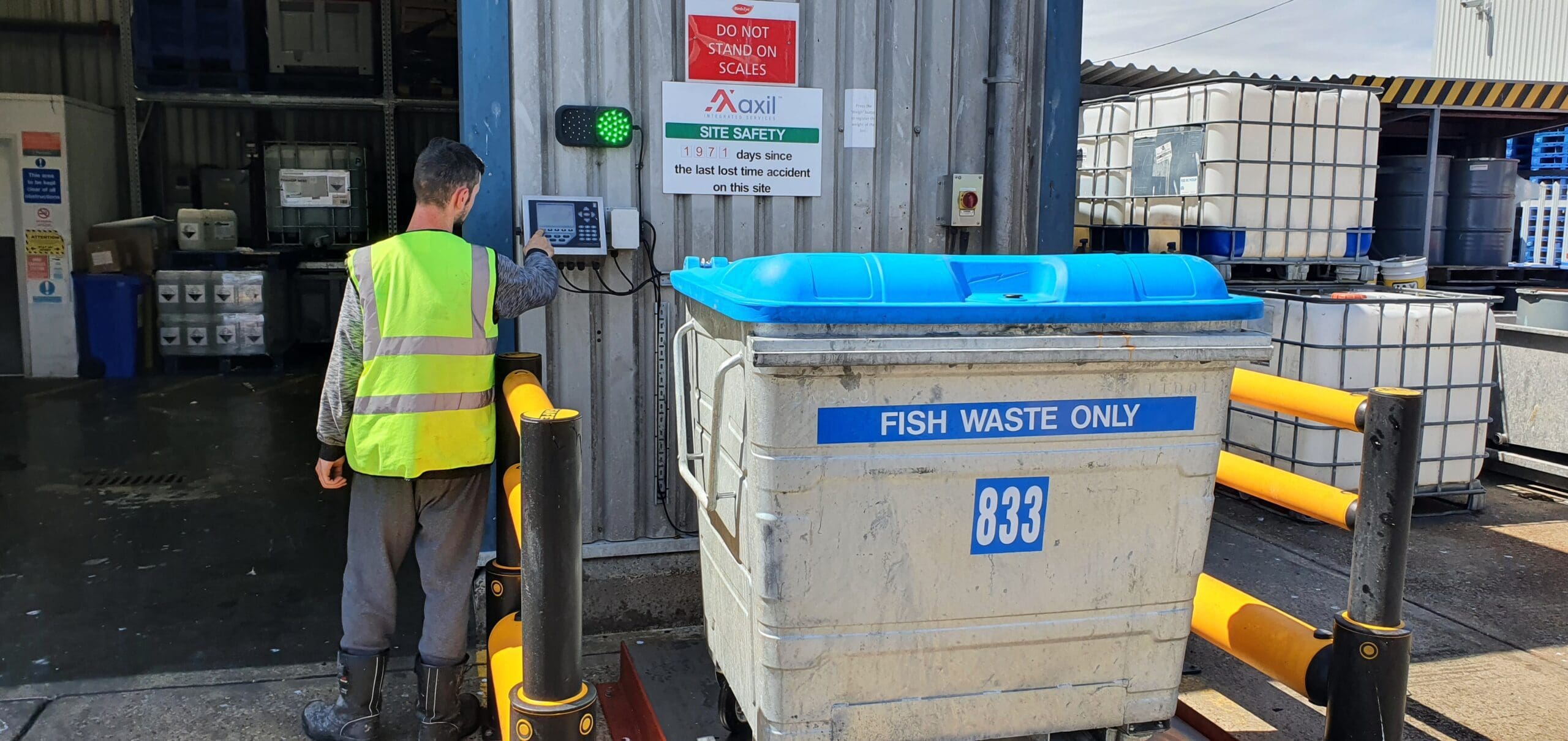 Operative performing food waste management duties with fish