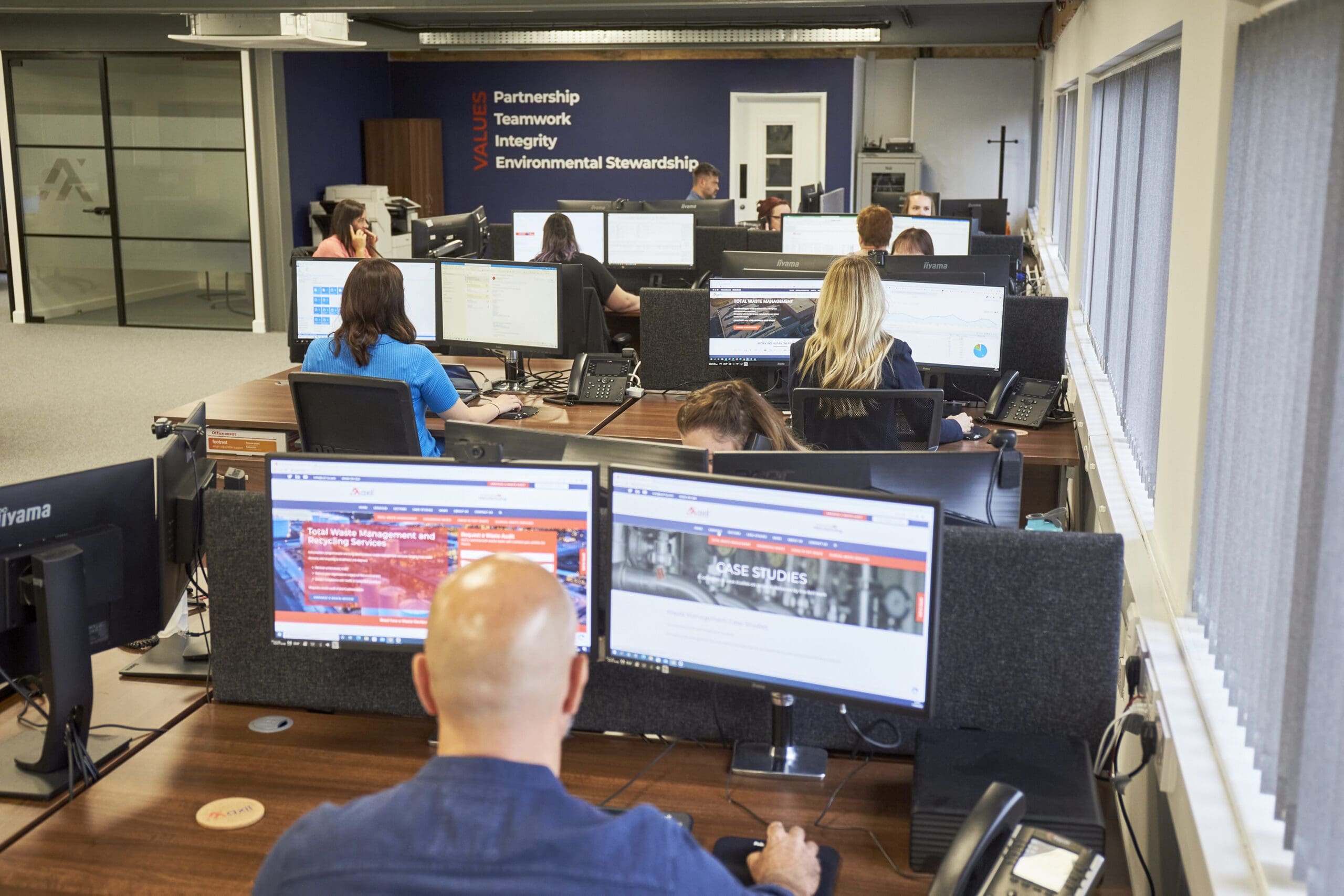 Axil employees working in Axil Corby office