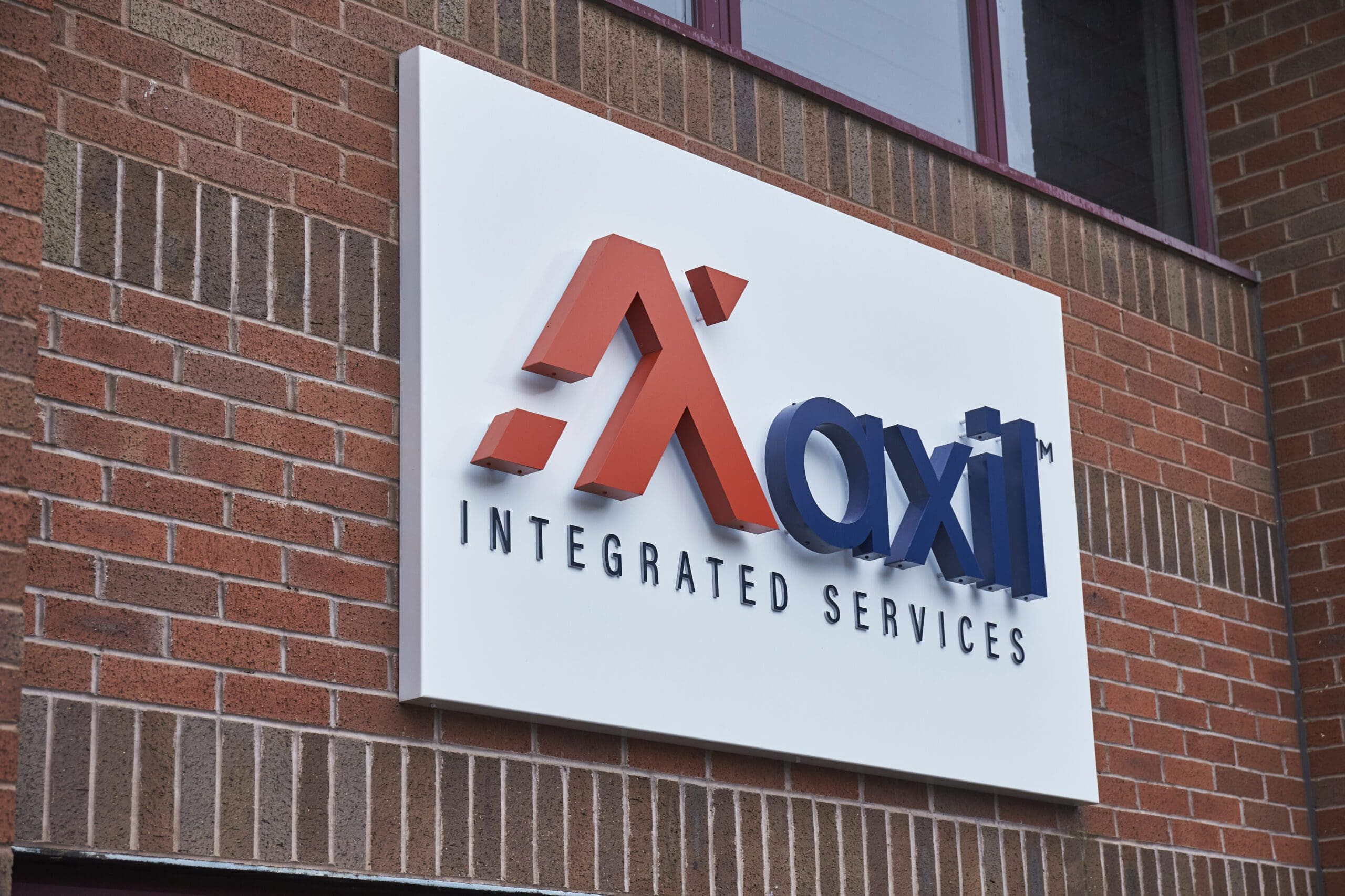 Axil sign on the front of Corby office